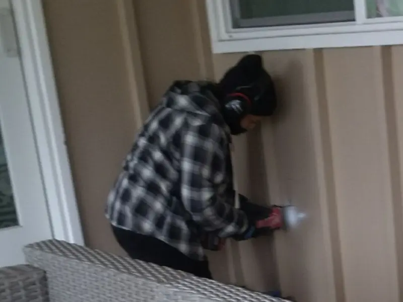 Professional electrician installing an exterior outlet in Markham